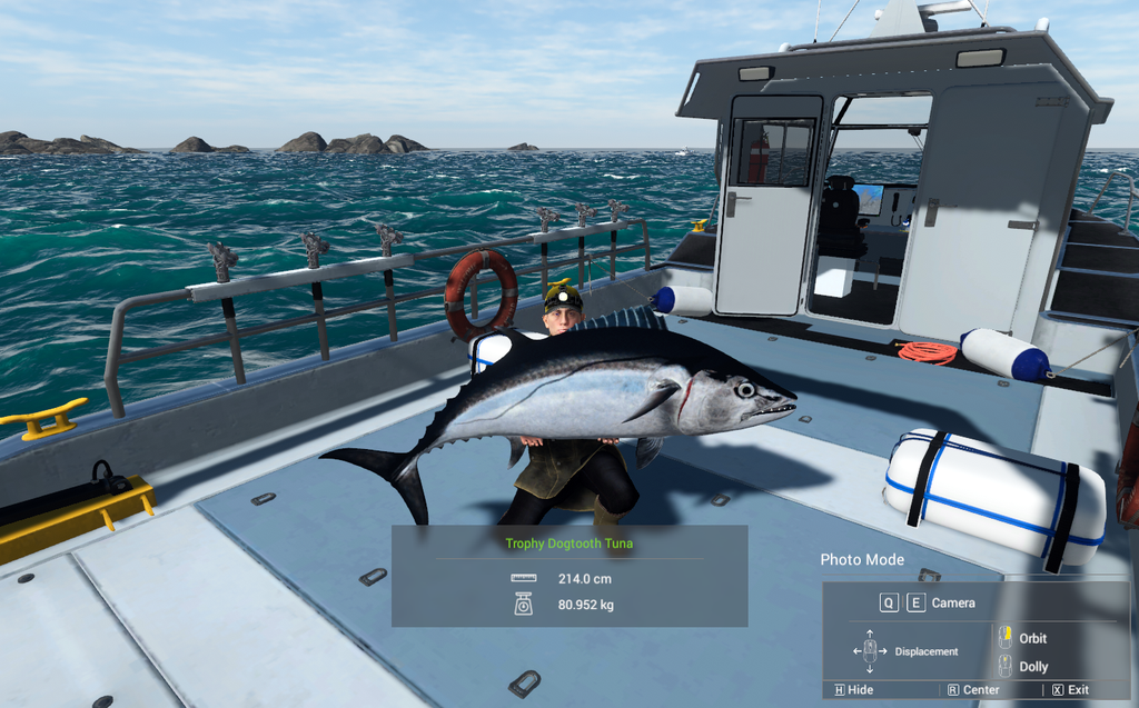 Dogtooth Tuna held on the boat deck with reef islands behind in Fishing Planet at Kaiji No Ri